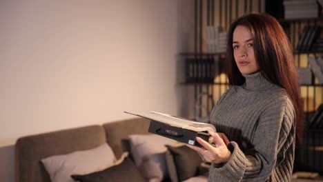 pretty woman at furniture store looking at textile swatch pretty woman at furniture store looking at textile swatch high quality footage