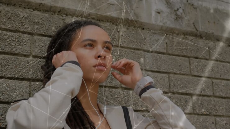 Animation of network of connections over fit woman wearing earphones