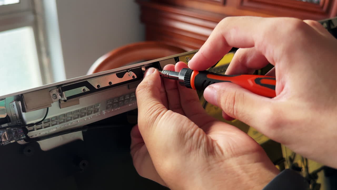 Man self repairing a computer