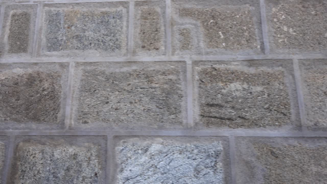 Stone wall in the Monastery of San Juan de los Reyes in Toledo, Spain. Shooting in the movement
