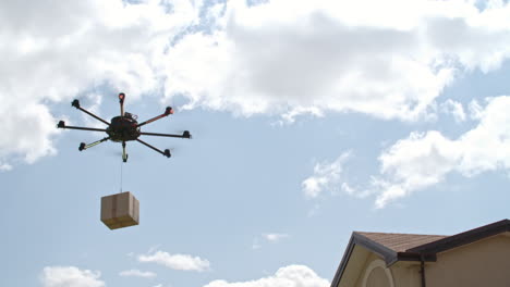 Flying-Drone-Delivers-A-Package-To-A-Waiting-Couple-In-The-Garden