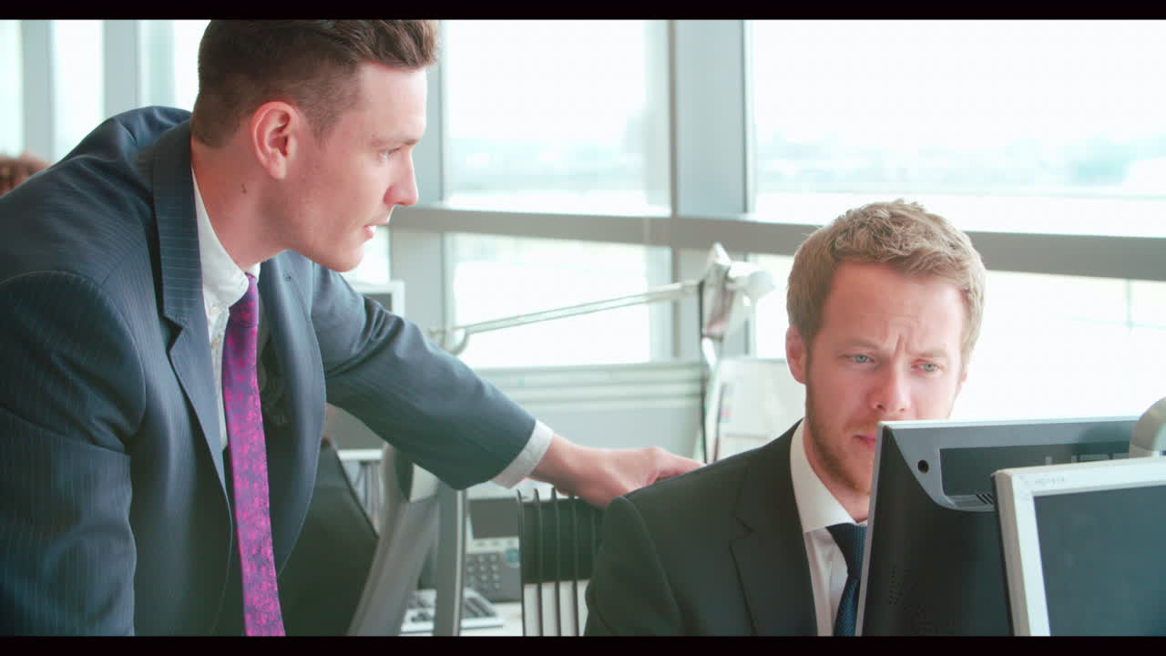Panning shot down the entrance of a modern business building
