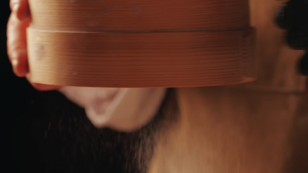 Bakery chef applying flour on dough close- up macro, young man kneading dough, making bread using traditional recipe. Artisan bread is making by skill bakers using natural and high-quality ingredients. Food with health and flavour benefits.