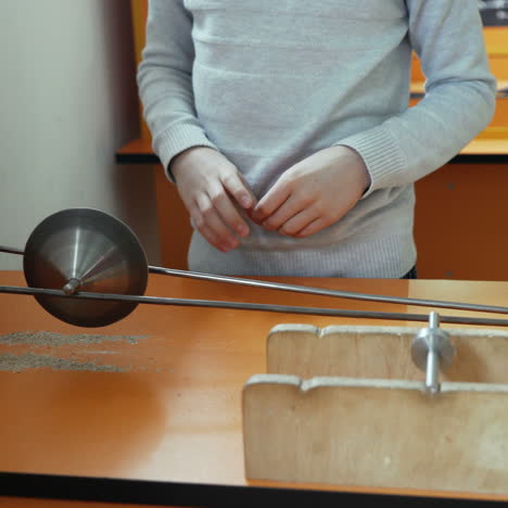 boy looks like a cone falls down under the action of the center of mass. concept of physics. museum of science square video