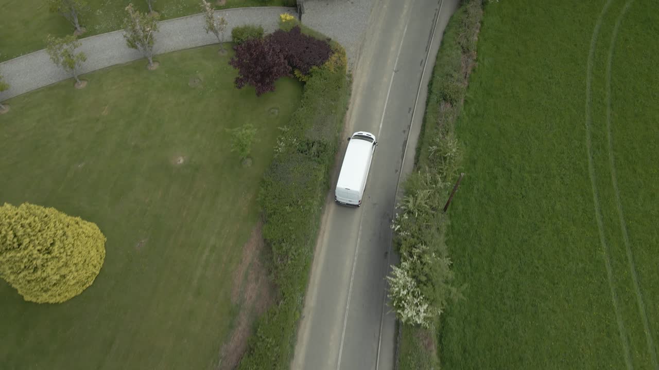 Solo only courier delivery van commuting on it's daily route Ireland aerial