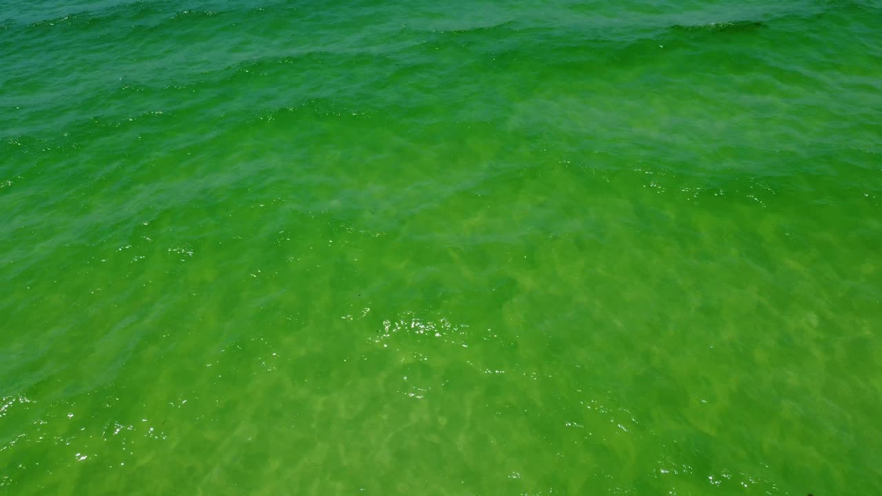 Aerial view of turquoise green water of gulf of Mexico in fort Walton beach Destin Florida.