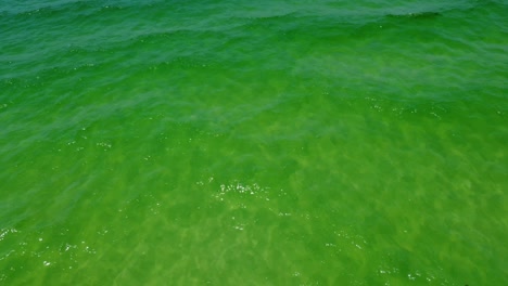 aerial view of turquoise green water of gulf of mexico in fort walton beach destin florida.