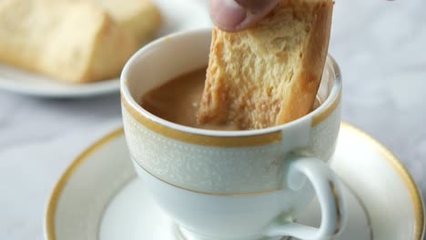 biscotti dipping in coffee