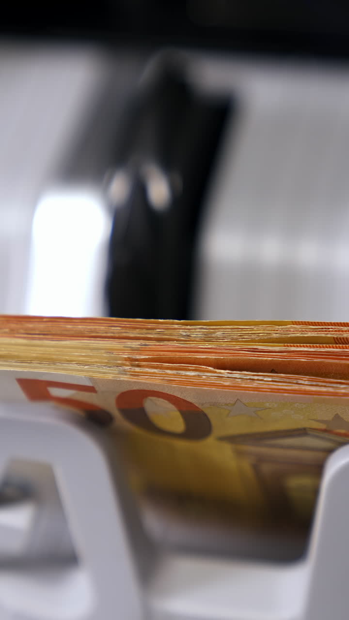 Money counting machine. Euro banknotes Vertical video