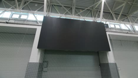 large digital screen on wall by field for sportsmen training