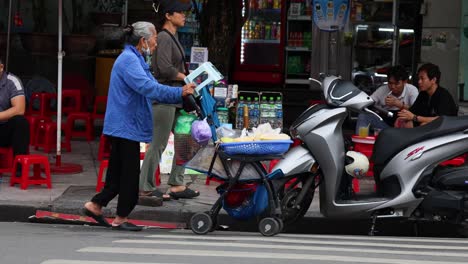 vendor selling goods to pedestrians and motorcyclists