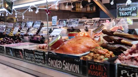 variety of cheeses and gourmet foods displayed