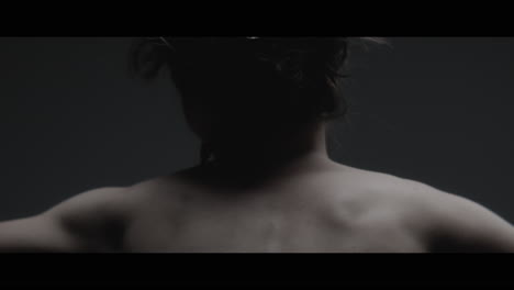 a woman dressed as mother nature moves slowly in a dance-like motion