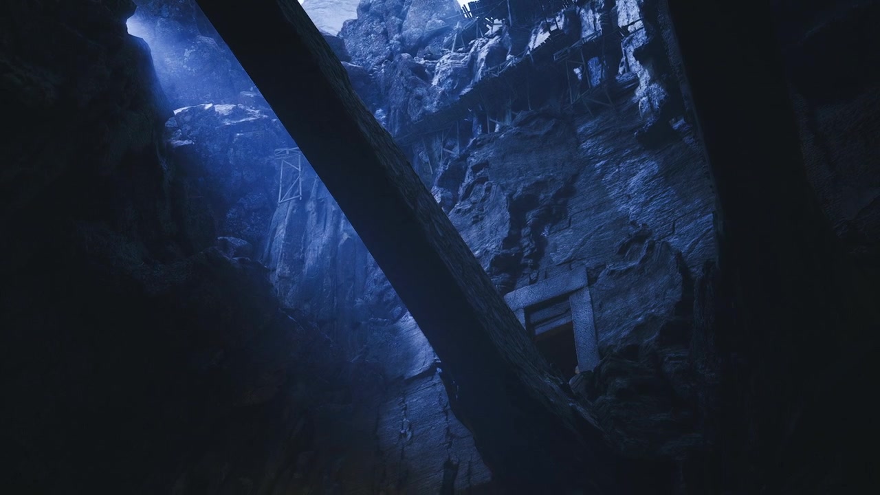 Mountainous landscape featuring rugged cliffs and distant canopy
