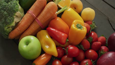 video of fresh apples, carrots, peppers and tomatoes on black background