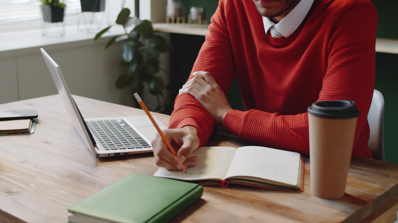 Young Man Working at a Desk