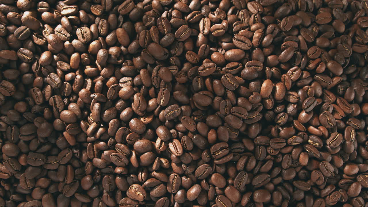 Roasted Coffee Beans Cooling Or Degassing In A Roastery - Top View, Dolly In