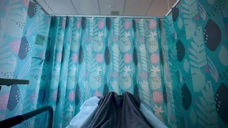 empty hospital bed titling from persons feet under blanket to ceiling perth wa