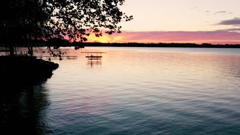 sunrise over a lake in rural wisconsin, usa