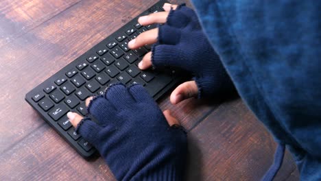 person hacking a keyboard