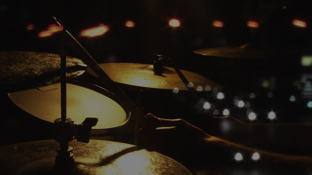 Cymbal cluster with drummer's hands entering from right, striking cymbals, making warm rhythm