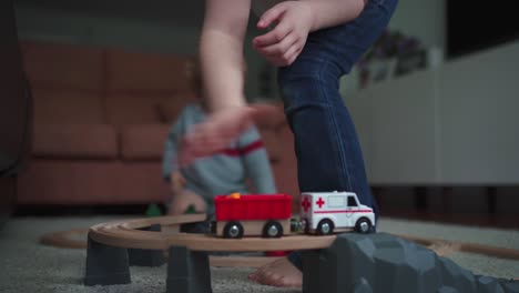 kids playing with toy track game together