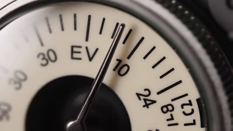close-up of an analog meter dial with a needle