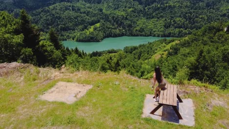 girl walks, sits on a bench and sees the view