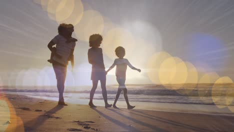 animation of light spots over african american family walking together