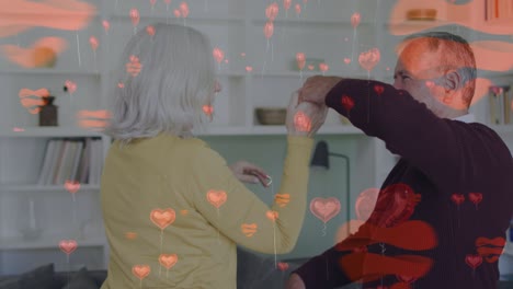 animación de iconos de corazón sobre una pareja caucásica de alto nivel bailando