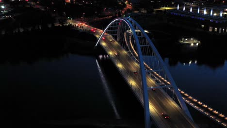 Aerial-drone-view-of-the-Edmonton-Walterdale-Bridge-over-the-North-Saskatchewan-River-during-a-summer-night-and-the-downtown-skyline-in-the-background