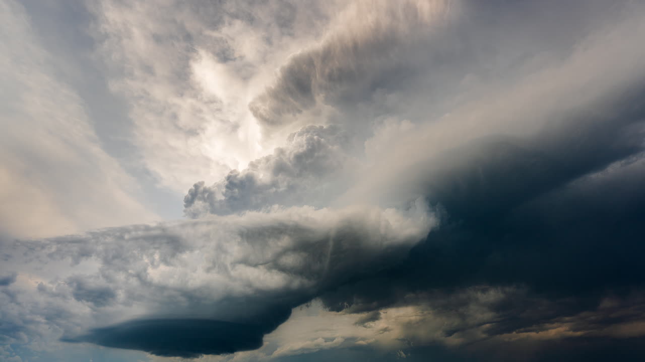 Powerful thunderstorm clouds building high into the atmosphere beautiful dark storm