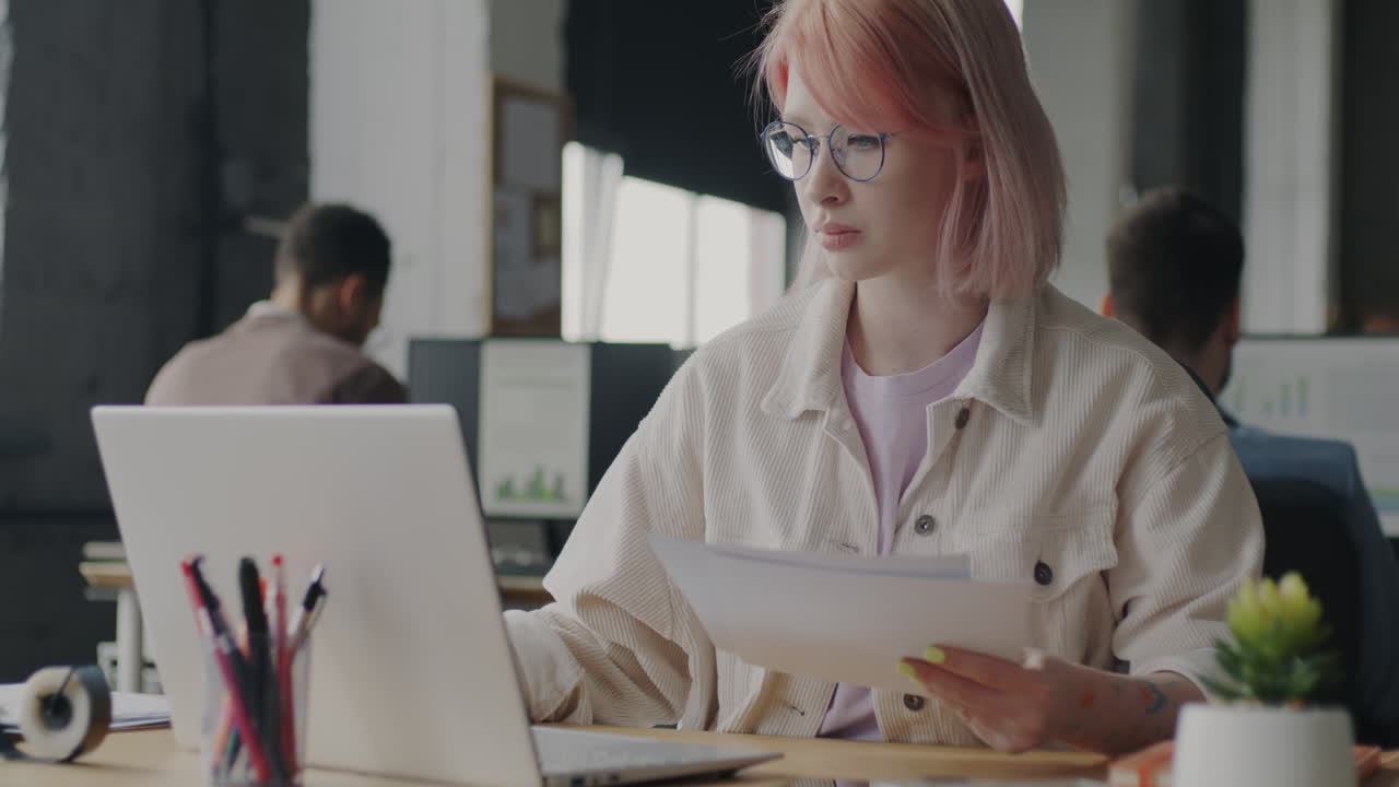 Woman working at a desk in a modern office