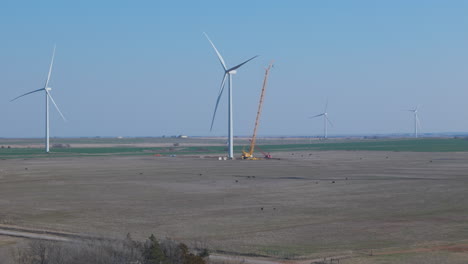 Oklahoma---Wide-Aerial-of-Wind-Turbine-under-repair-with-crane