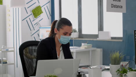 freelancer wearing face mask to prevent infection with covid19