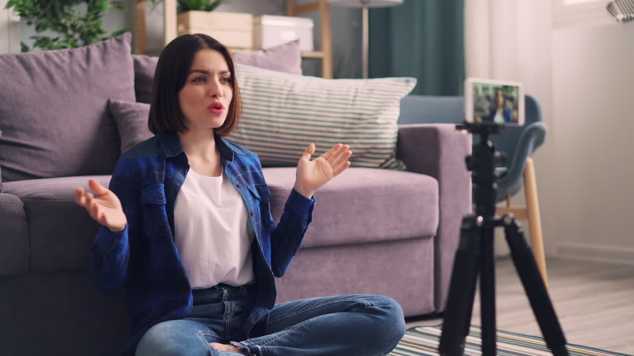 Woman vlogging in her living room