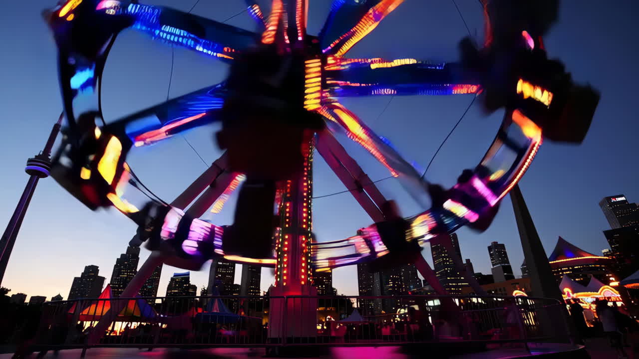 Spinning Carousel at Night in a City