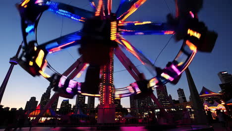 spinning carousel at night in a city