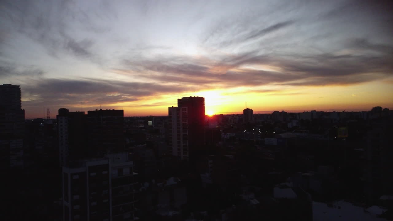 The sun sets over the horizon, the sun is on the horizon, sunrise or sunset over the city, shooting from a drone