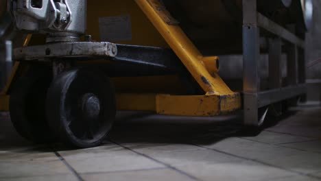 a hand cart, carrying casks of wine barrels, is lowered in stunning 4k resolution