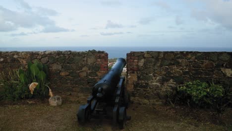 war time canon ready for batte at the wall of fort king george, tobago, west indies