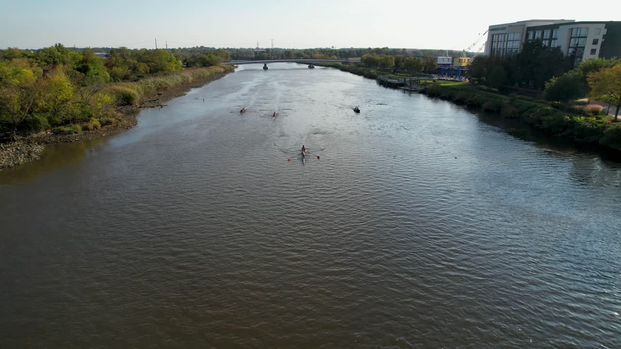 Dramatic shot of rowers rowing team sliding right under drone