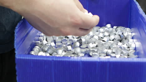 worker hands close up checking power press industrial manufacturing production