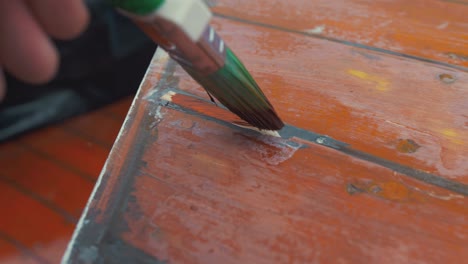 painting wooden slip repair to boat wheelhouse roof planking