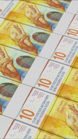 vertical video of 10 swiss franc banknotes printing by a money press