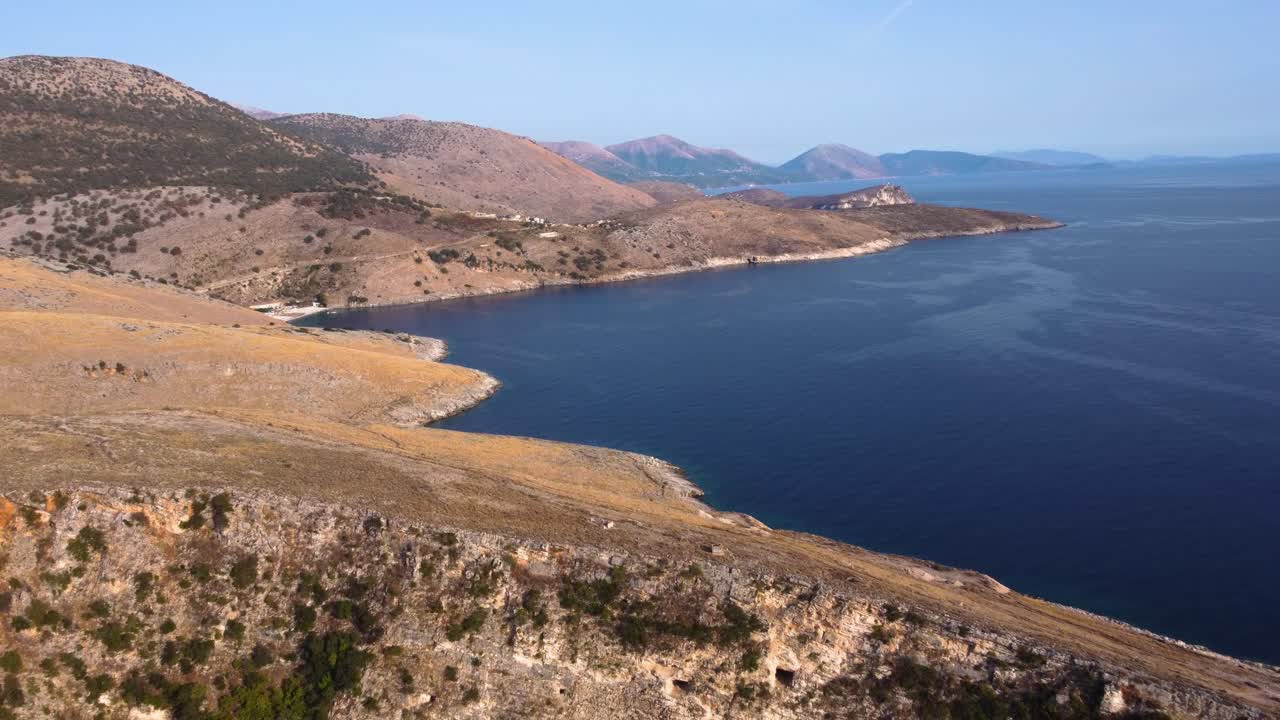 AERIAL Flying Backwards Shot of a Mountainous Albanian Coastline