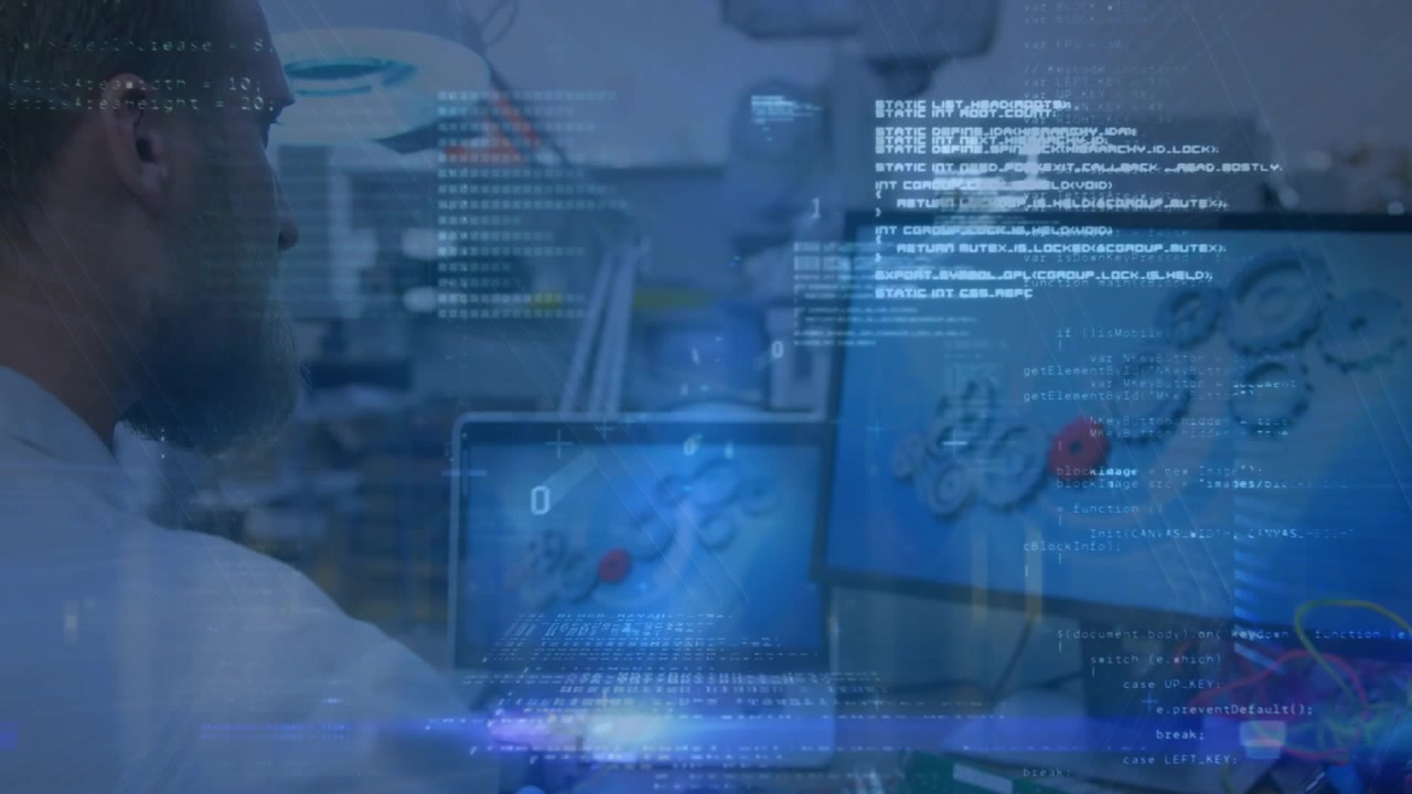 Bearded Man Working on Computers with Digital Code Overlay