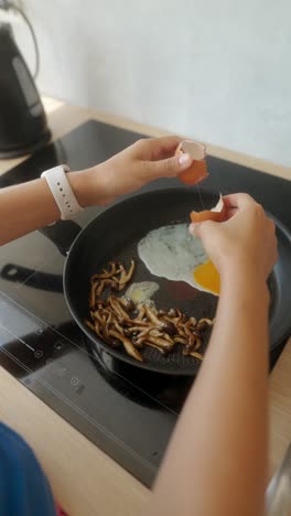 preparing a delicious breakfast with eggs and mushrooms