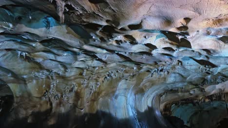 a view of laminated micritic limestone interior of kek lok tong cave temple in ipoh, malaysia. tracking shot