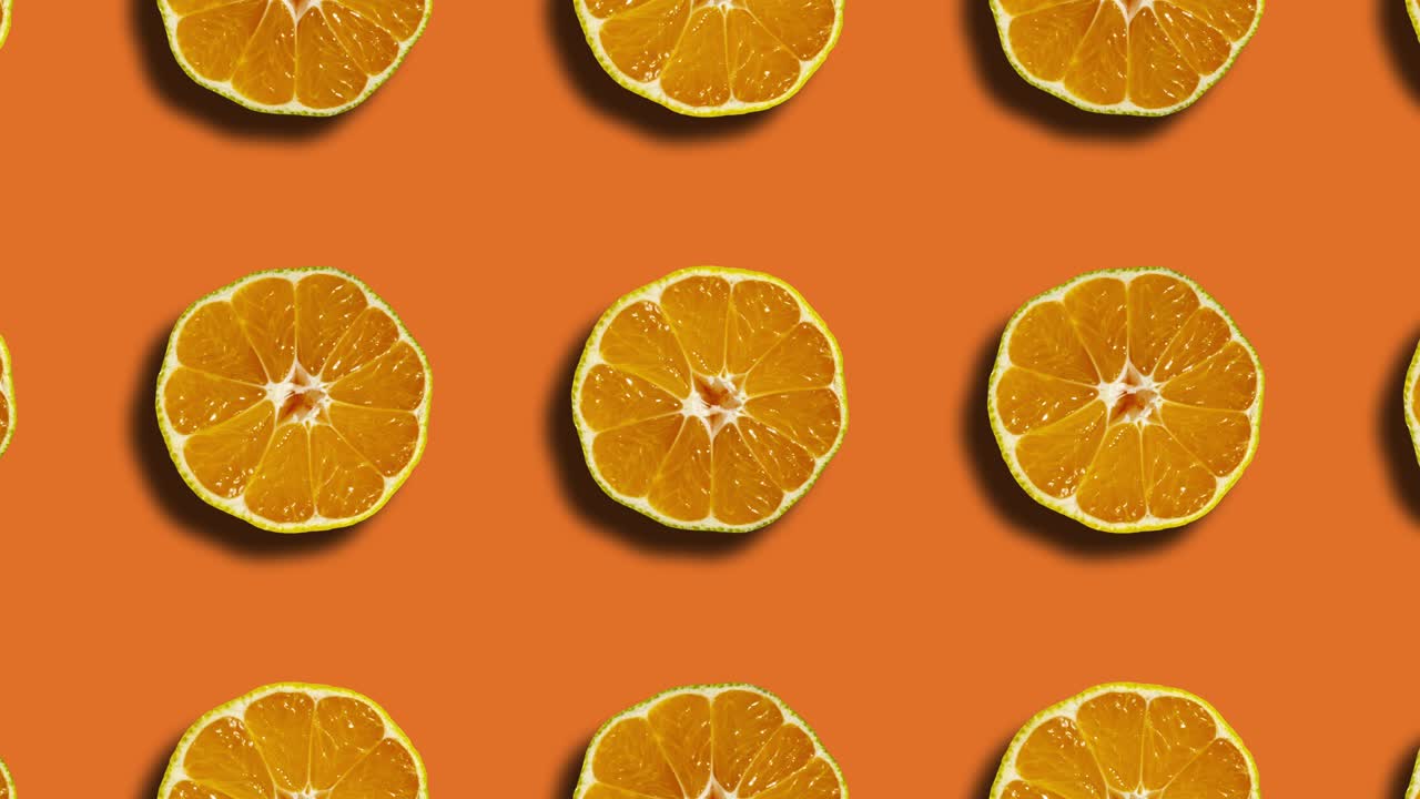 fondo naranja con patrón mandarín en cuadrícula geométrica. gráficos de movimiento sin costuras simples animación de frutas de la naturaleza